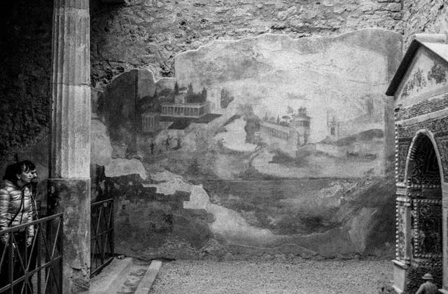 Photograph of A Remnant Room in Pompeii and Two Observers